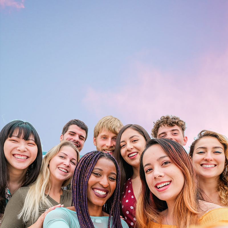 Group of diverse teens smiling and laughing together